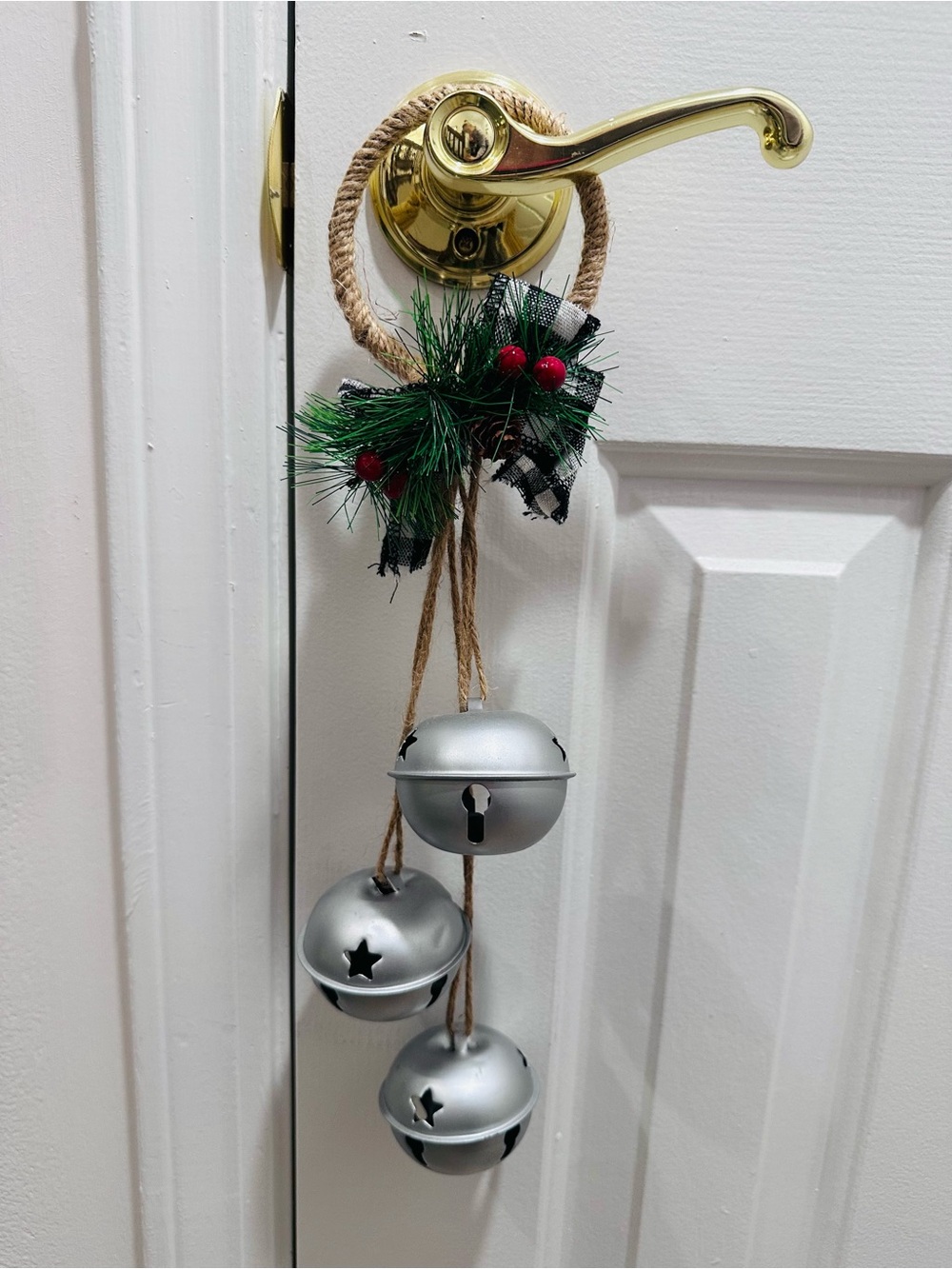 Holiday Silver Jingle Bell Door Hanger with Green Pine Accents